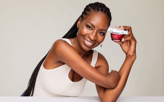 Woman holds Olay jar